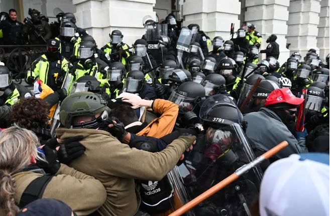 FBI hunts more suspects and charges more than 535 people over US Capitol riot to court 1 2 22